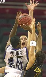 Jitim Young (25) shoots over VCU's Konstantin Nesterov Wedndesday at the BCA Invitational