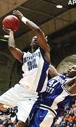 Collier Drayton (32) drives to the basket past KSU's Pervis Pasco (44) in the first half