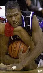 Jitim Young battles for a loose ball Sunday in Madison