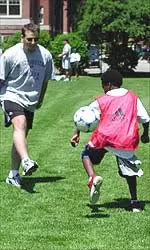 The men's soccer team demonstrated footwork and ball handling skills and had the youth participate in a friendly game and even a shot on goal contest.