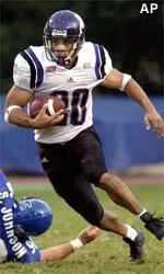 Tailback Damien Anderson breaks away from Duke's Shawn Johnson in the first quarter of the Wildcats' 44-7 win Saturday.