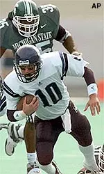 Quarterback Zak Kustok ran for three touchdowns and threw for two scores in Northwestern's victory over UNLV Friday.