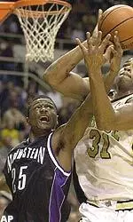 Northwestern's Jitim Young and Purdue's Rodney Smith battle for a rebound during the first half of their game Wednesday.