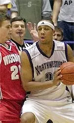 Northwestern's Tavaras Hardy tries to work around Wisconsin's Kirk Penney in the first half.