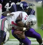 John Pickens forces one of the three fumbles by OSU freshman Maurice Clarett.