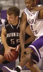 Northwestern center Aaron Jennings battles for a rebound in the first half, Saturday.