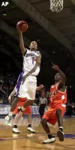 Northwestern's T. J. Parker lays up the ball for the winning basket on Saturday over Bowling Green.