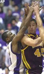 Jitim Young pressures Minnesota's Dusty Wychart in the Wildcats' win Wednesday.
