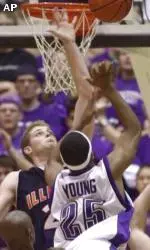 Jitim Young tries to shoot over Illinois forward Robert Archibald during the game on Saturday.