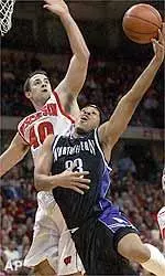 Northwestern's Tavaras Hardy shoots against Wisconsin' s Charlie Wills during the first half Saturday.