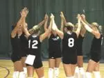 Members of the Northwestern women's volleyball team huddle during a recent practice
