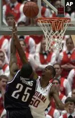 Jitim Young scores two of his 10 points with this shot over Indiana's Jeff Newton.