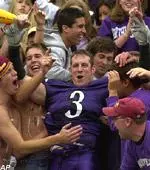 Pat Durr celebrates NU's win over Wisconsin with some fans.