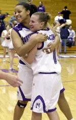 Senior Leslie Dolland (left) celebrates a 50-46 win over Indiana with Samantha McComb on senior night.