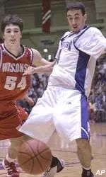 UW's Mike Wilkinson and NU'sMohamed Hachad scramble for a loose ball Saturday.