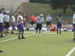 Offensive coordinator Mike Dunbar calls out signals during practice.