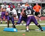 Receiver Brandon Horn takes on defenders in Tuesday's "hamburger" drill.