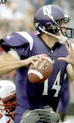 Brett Basanez looks for an open receiver during the first quarter.