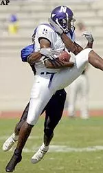Roger Jordan makes the catch for a first down and is tackled by Duke's Kenneth Stanford.