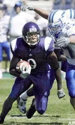 Receiver Mark Philmore runs after making a catch as Air Force linebacker Dennis Poland pursues in the second quarter.