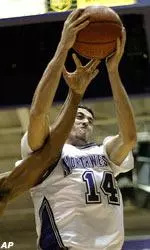 Northwestern's Mohamed Hachad fights for a rebound during the first half.