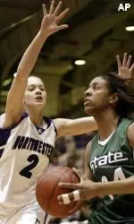 MSU's Rene Haynes pulls up for a jump-shot as A. J. Glasauer defends during the first half.