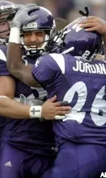 Noah Herron celebrates his game-winning touchdown with Loren Howard (left) and Terrell Jordan.