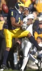Marvin Ward notches one of his two pass deflections against Michigan's Braylon Edwards. Edwards finished with just 54 receiving yards -- 57 yards below his average.