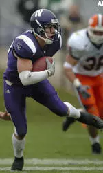 Jeff Backes eludes Illinois tacklers on the way to the end zone on his game-tying 73-yard punt return on Saturday.