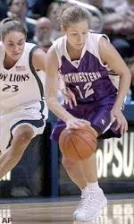 Melissa Culver protects her dribble against a Penn State defender.