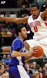 Mohamed Hachad looks to pass around Ohio State's J.J. Sullinger during the first half.