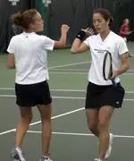 Cristelle Grier (right) and Jessica Rush outlasted their opponents in three sets to advance to the quarterfinal round.