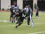 The Wildcats run through drills on day 2, waiting for full pads on Friday.