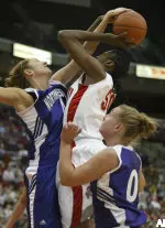 Sarah Kwasinski blocks the shot of Ohio State's Jesica Davenport during the first half.