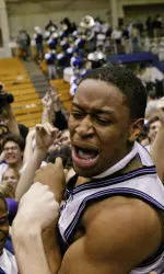 Michael Jenkins is hoisted up by teammates and fans after hitting a last-second, three-pointer.