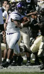 Northwestern's Tyrell Sutton left, is tackled by Purdue's Bernard Pollard after a 40-yard run during the second quarter. (AP Photo/Darron Cummings)