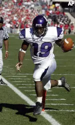Northwestern running back Tyrell Sutton scores on a 5-yard TD reception against Ohio State in the first quarter. (AP Photo/Jay LaPrete)