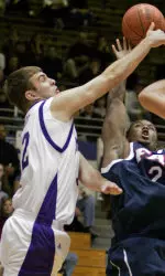 Vince Scott, left, blocks FAU's DeAndre Rice as he tries to shoot. (AP Photo)