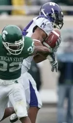 Safety Herschel Henderson intercepts a pass at Michigan State.