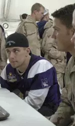 Quarterback Brett Basanez listens to troops at Fort Bliss Tuesday morning.