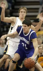 Davor Duvancic looks to drive around Iowa's Adam Haluska. (AP Photo/Charlie Neibergall)