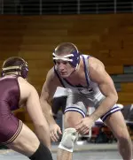 Senior Mike Kimberlin recorded an upset over 13th-ranked Tyler Turner in his final home match at Northwestern.