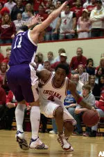 Bracey Wright drives to the basket as Vedran Vukusic defends during the first half.