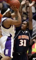 Northwestern's Michael Jenkins drives on Illinois' Jamar Smith. (AP Photo/M. Spencer Green)