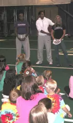 Women's basketball players talk to scouts before the volleyball match against Iowa Friday night.