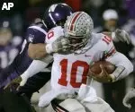 The Wildcats tried to slow down Heisman Trophy candidate Troy Smith.