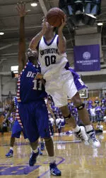 Tim Doyle shoots over DePaul's Sammy Mejia during the second half.