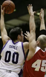Tim Doyle shoots over Wisconsin's Joe Krabbenhoft during first half.