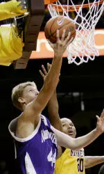 Kevin Coble scores a basket past Minnesota's Lawrence Westbrook in the first half.