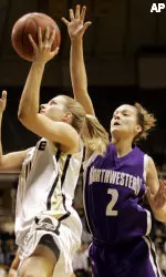 A.J. Glasauer tries to block the shot of Purdue's Lauren Mioton during the first half. (AP Photo/Tom Strattman)